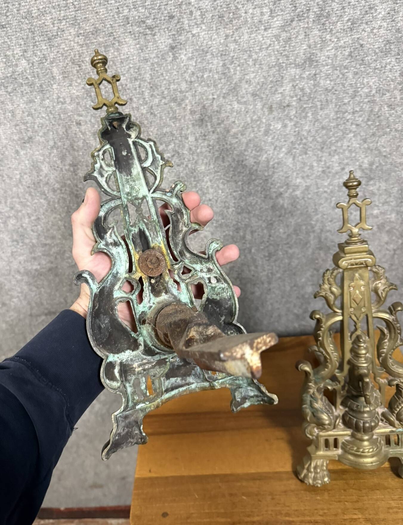 pair of Empire period dolphin firedogs in gilded bronze