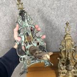 pair of Empire period dolphin firedogs in gilded bronze