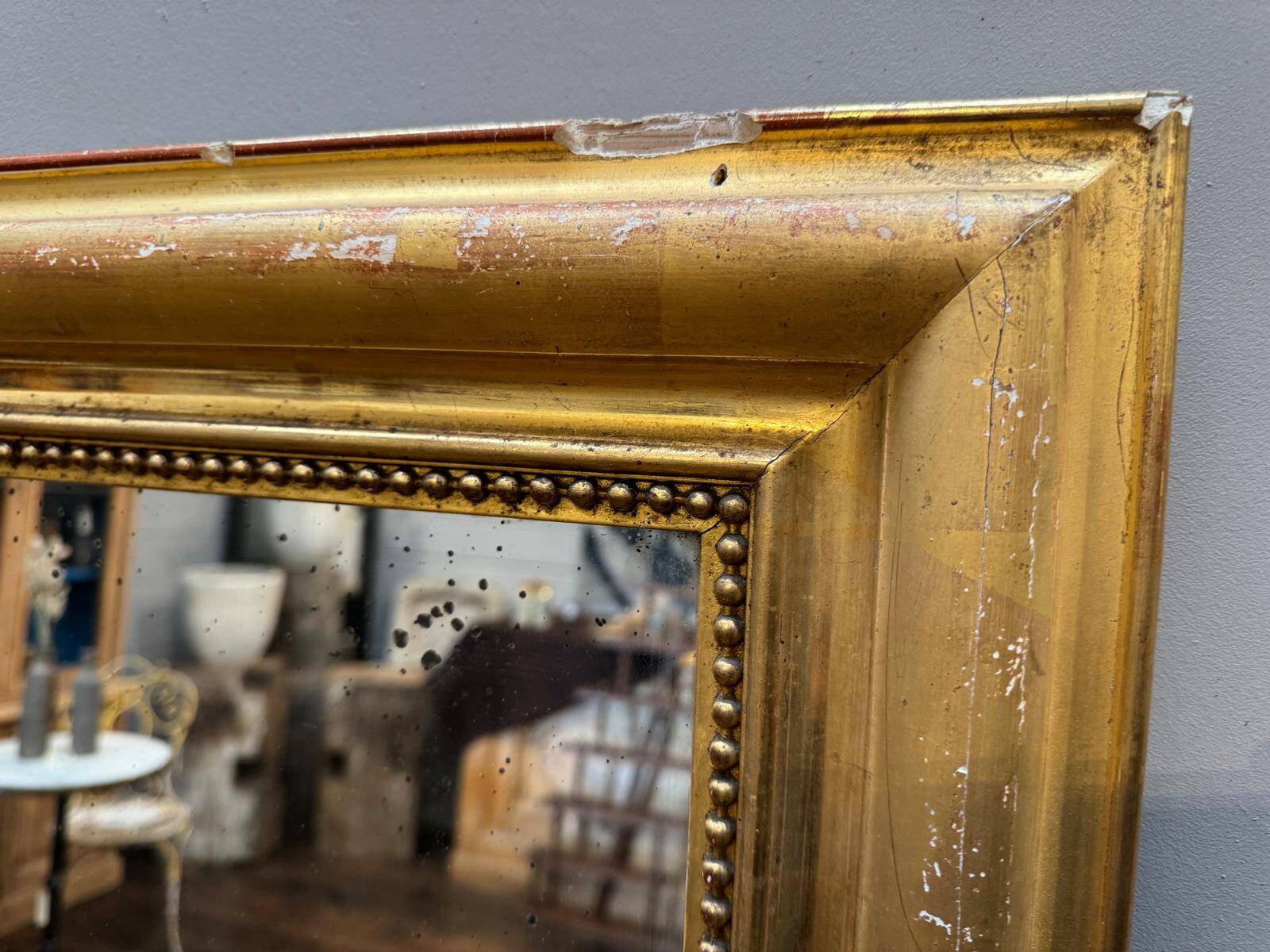 Antique gilded fireplace mirror