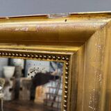 Old gilded fireplace mirror
