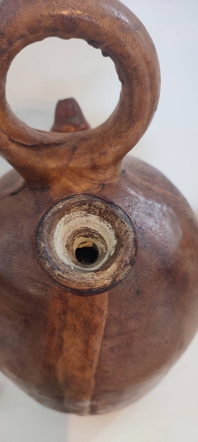 Gargoulette, terracotta jug covered with leather