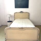 Carved and painted wooden bed