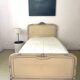 Carved and painted wooden bed