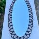 Miroir ovale en bambou et rotin, circa 1960