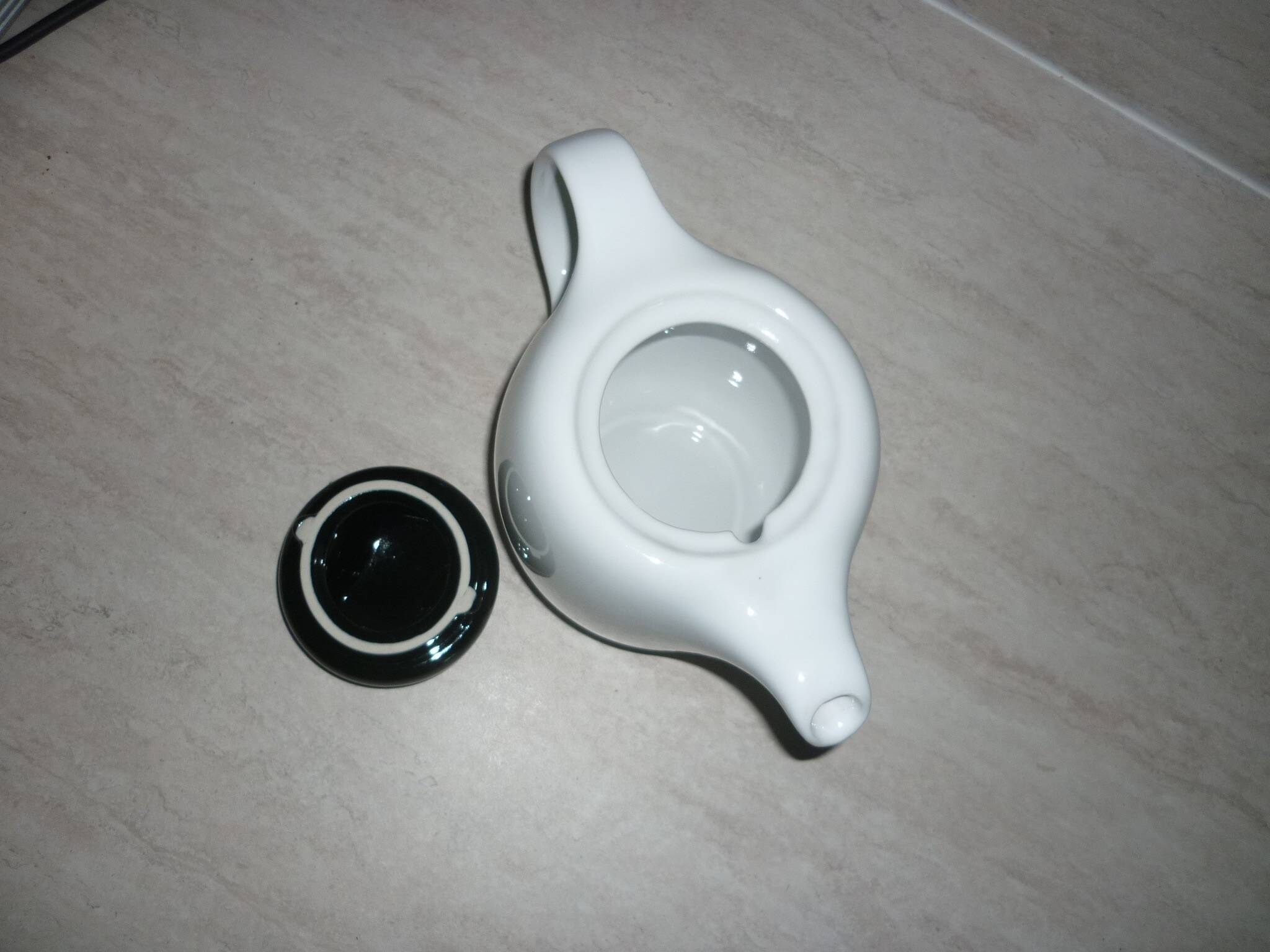 Black and white ceramic coffee maker