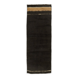 Small vintage flat-woven black rug.