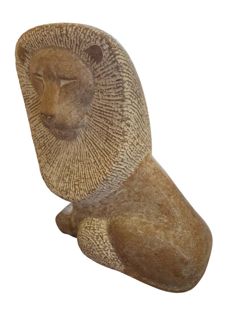 Sculpture of a lion in stone by Islay Grimes.