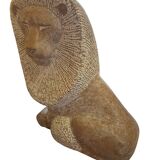 Sculpture of a lion in stone by Islay Grimes.