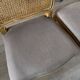 Four antique chairs in classic style with caning and upholstery.