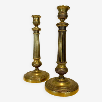 Pair of Louis XVI style candlesticks in 19th century chiseled bronze