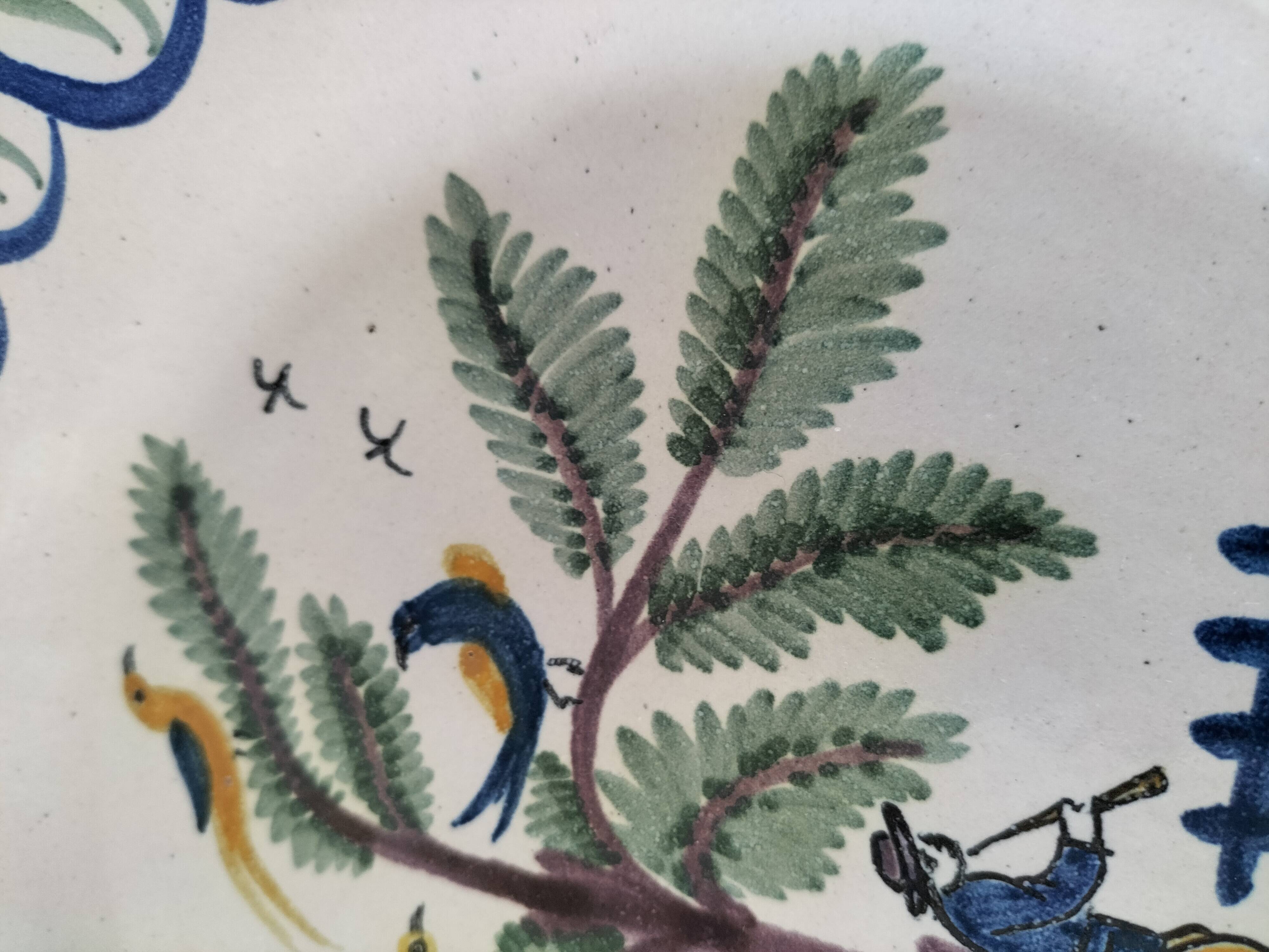 Antique hand-painted earthenware plate – piper and birds
