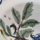 Antique hand-painted earthenware plate – piper and birds