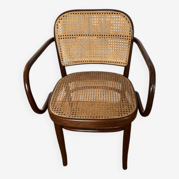 Curved wood and cane armchair