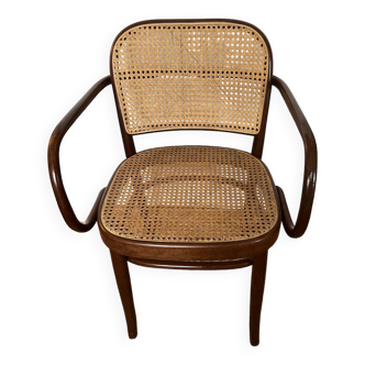 Curved wood and cane armchair