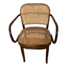 Curved wood and cane armchair