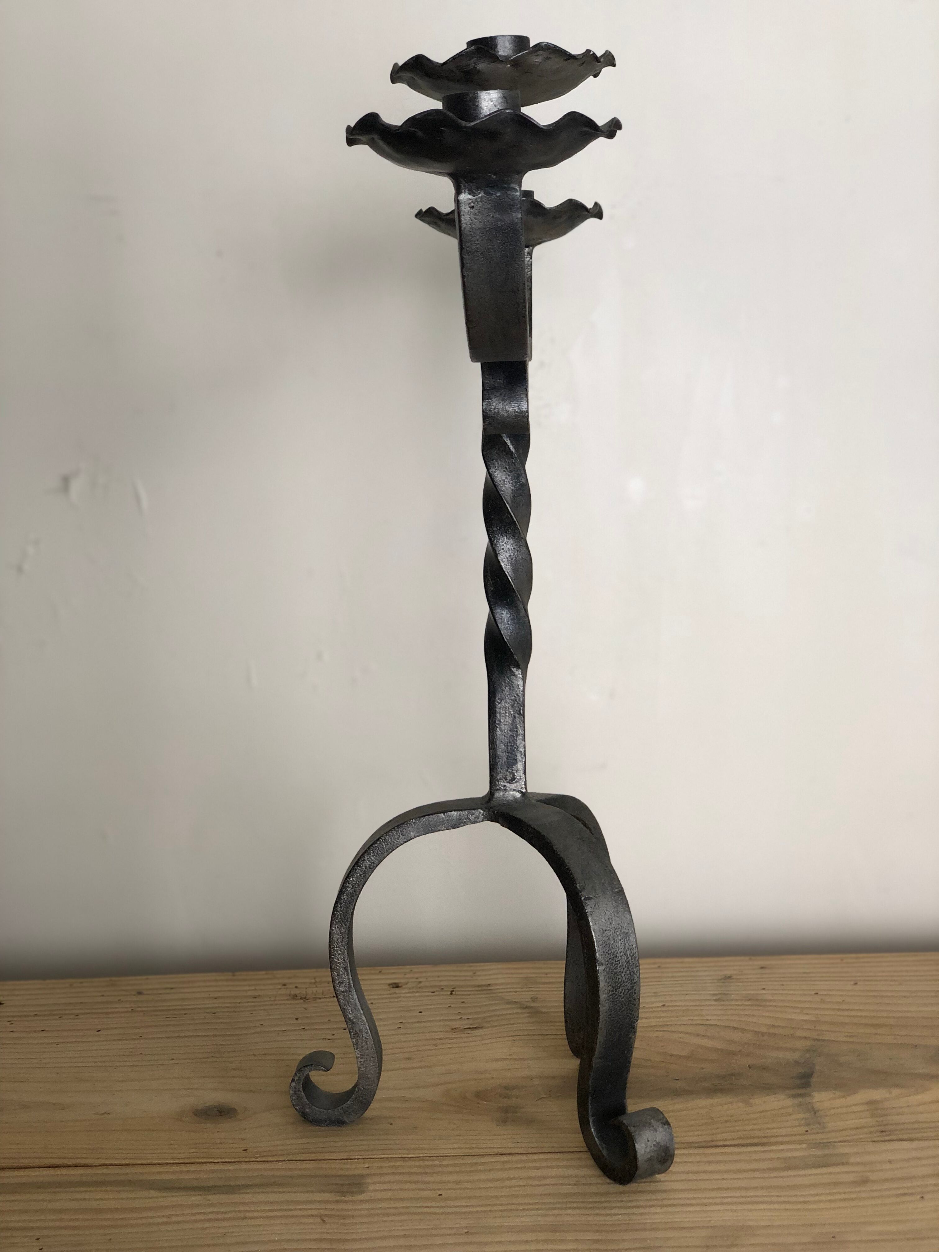 Pair of wrought iron candlesticks