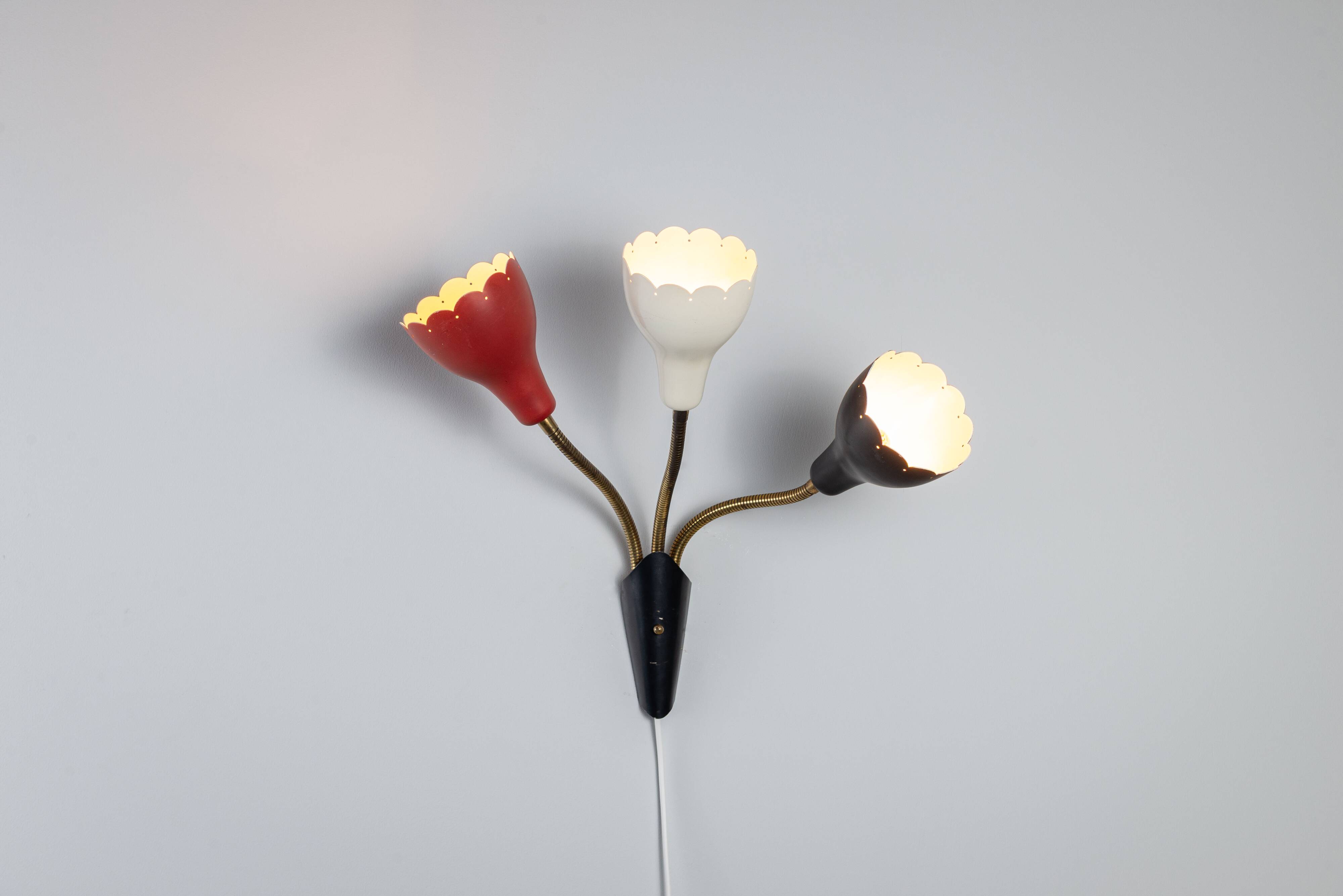 Adjustable wall lamp with three decorated shades in different colours