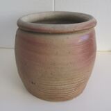 Ancient sandstone pot at one handle