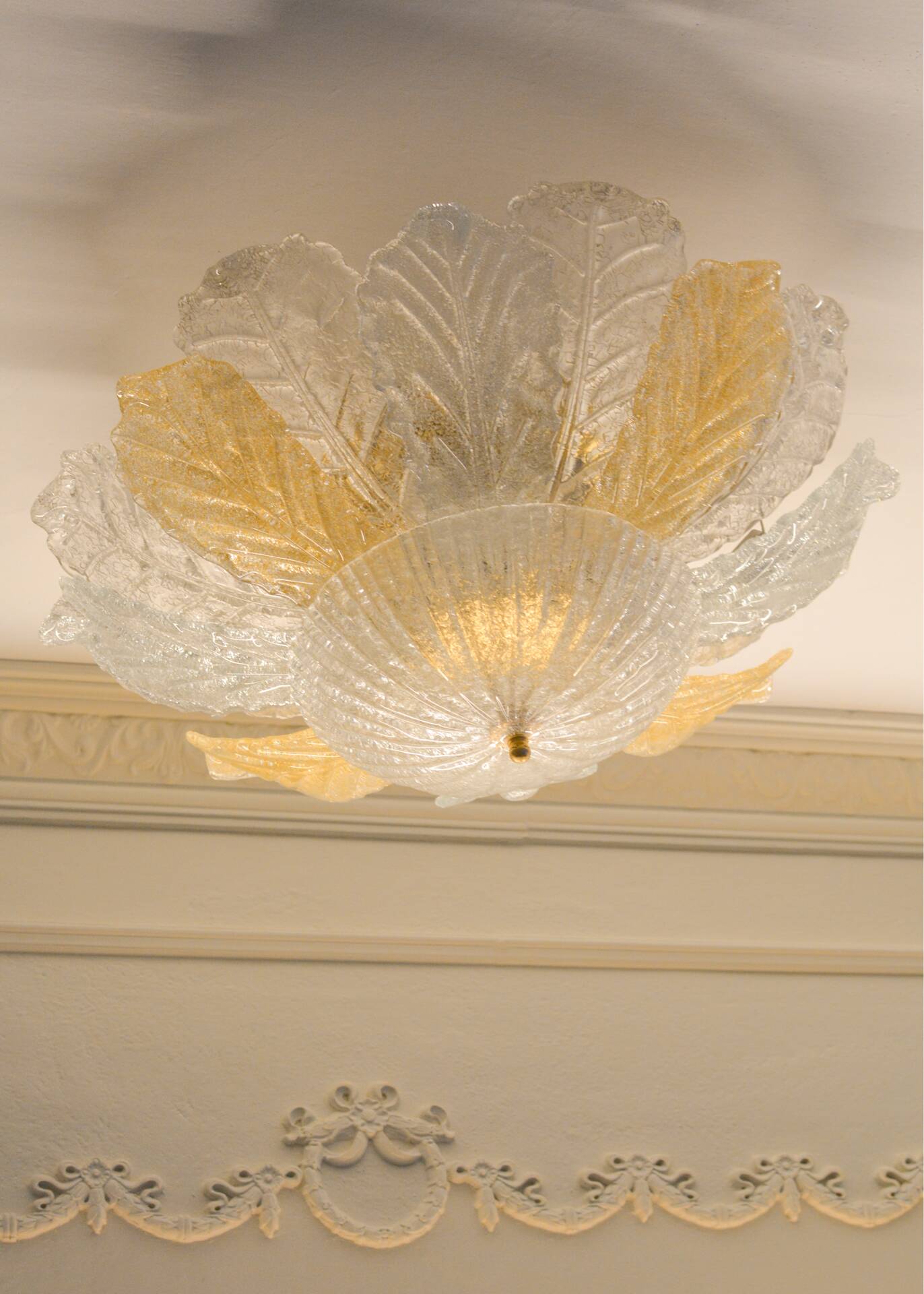 Vintage Murano chandelier/ceiling light with 16 white and amber leaves.
