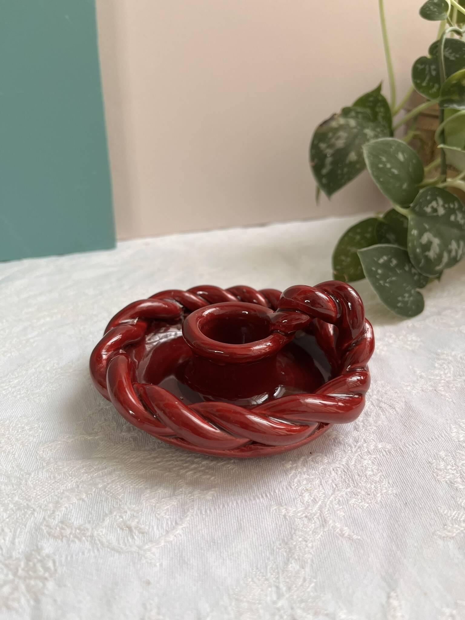 Twisted red earthenware candle holder - in the style of St Clément