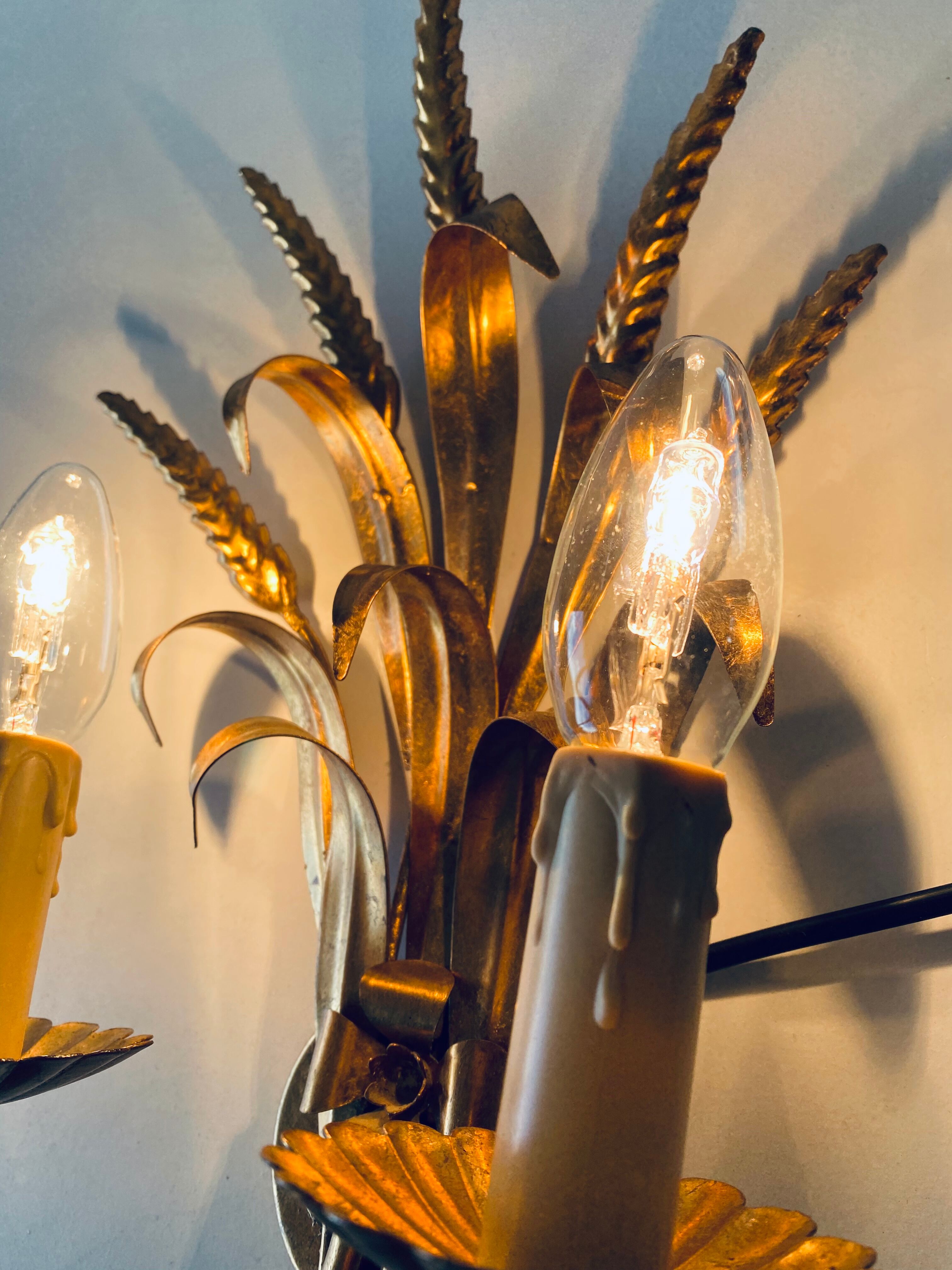 Double golden spike wall lamp