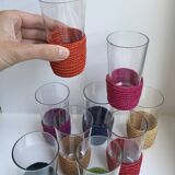 set of 9 small glasses with colored rattan support from the 70s
