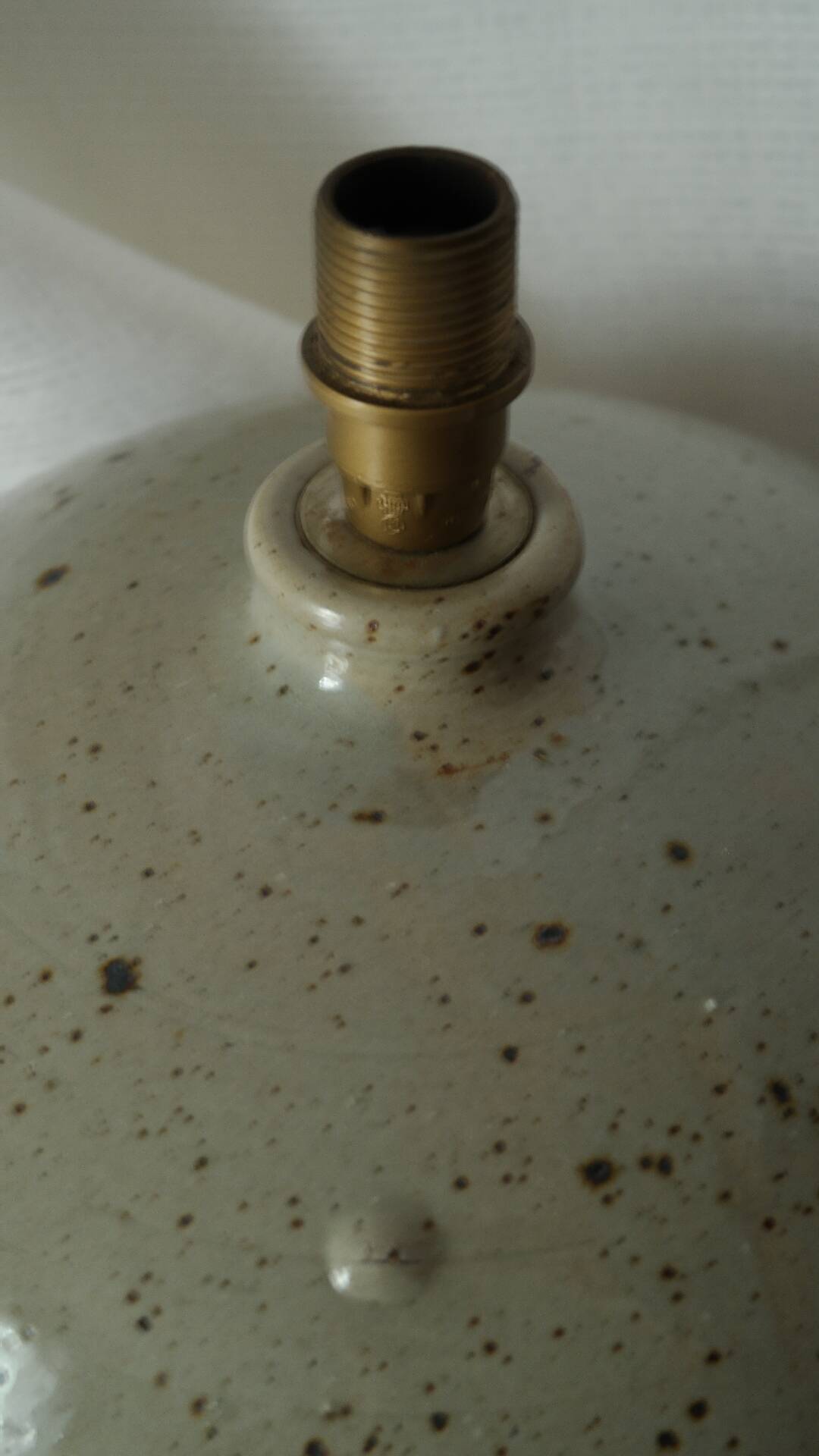 Vintage ceramic lamp with a wool shade.