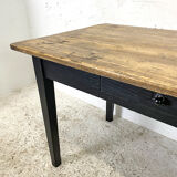 Varnished farmhouse table and blackened wood