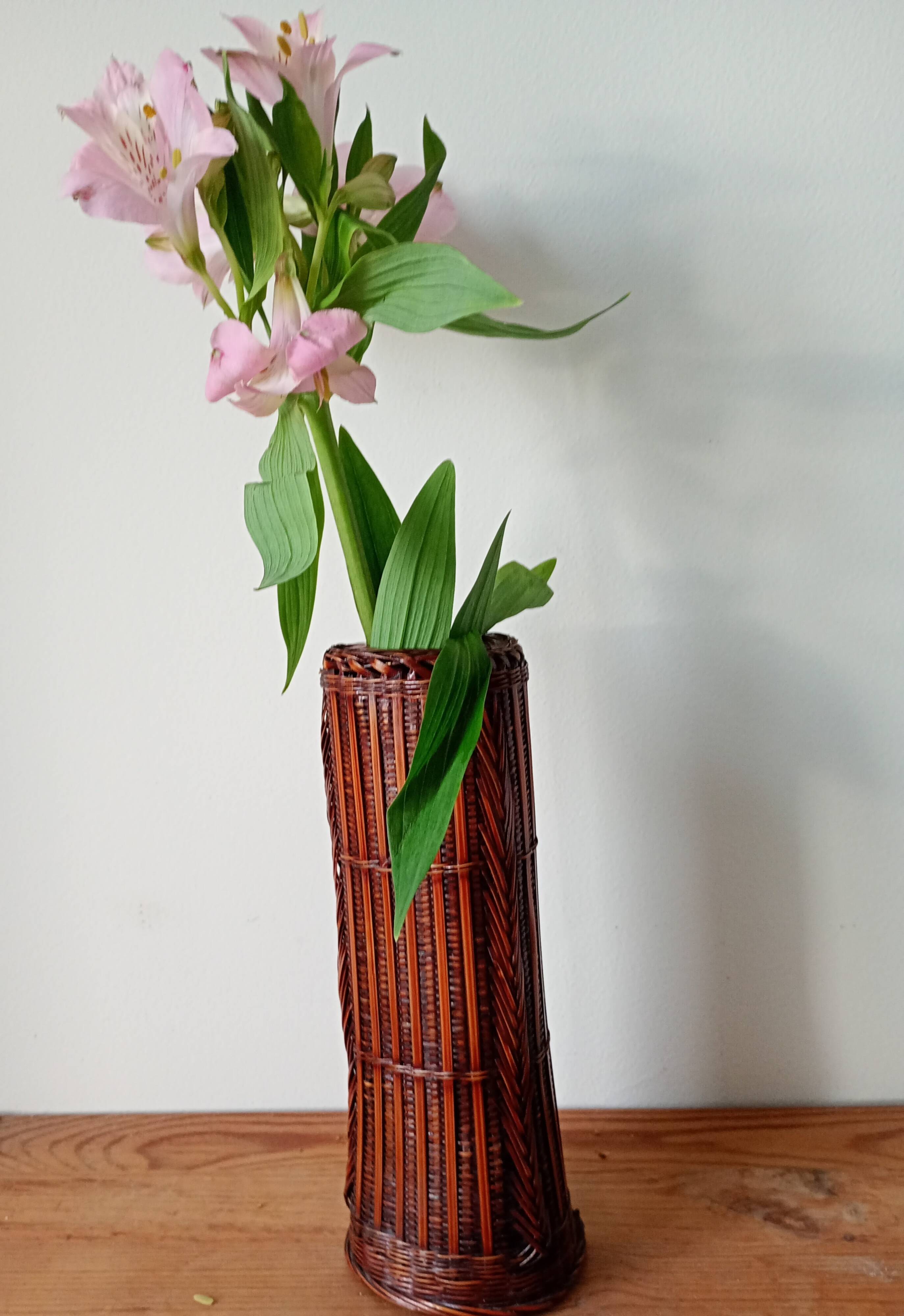 Japanese vase made of woven bamboo. Ikebana