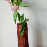 Japanese vase made of woven bamboo. Ikebana