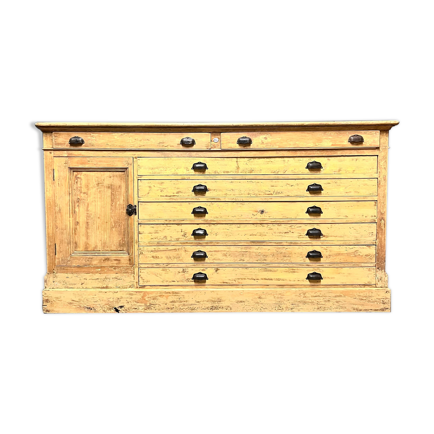 Old piece of furniture by trade with an architect's plan