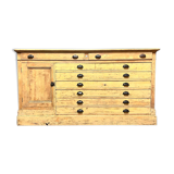 Old piece of furniture by trade with an architect's plan