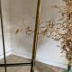 Vintage black metal and brass floor lamp with three white opal shades.