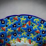 Longwy plate with polychrome enamels, decorated with the "City of Iron" motif.