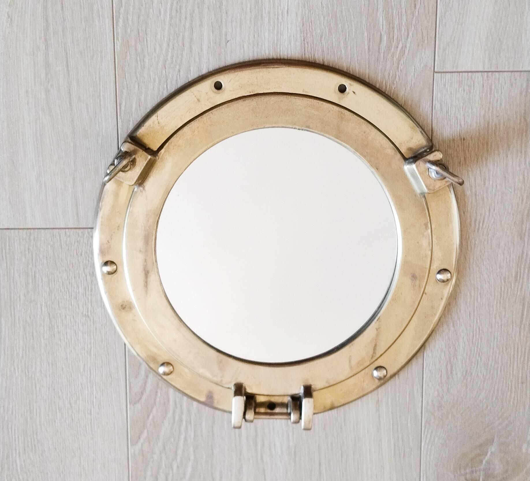 Porthole mirror in gilded brass, marine mirror
