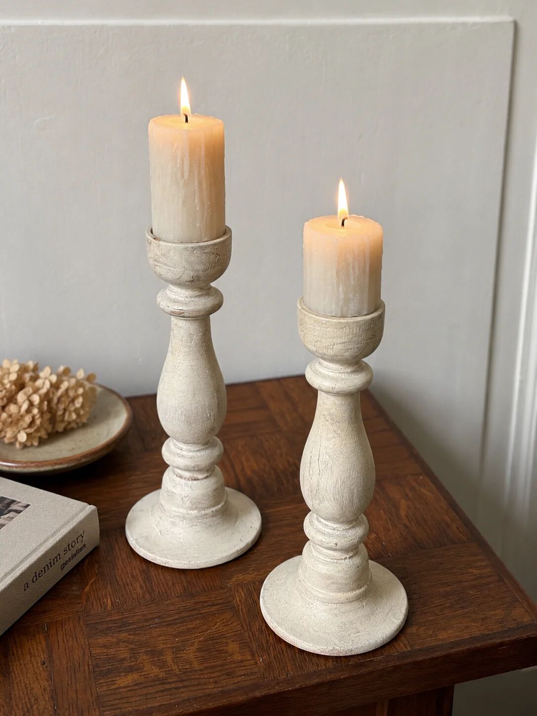 Pair of white wooden candlesticks