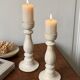 Pair of white wooden candlesticks