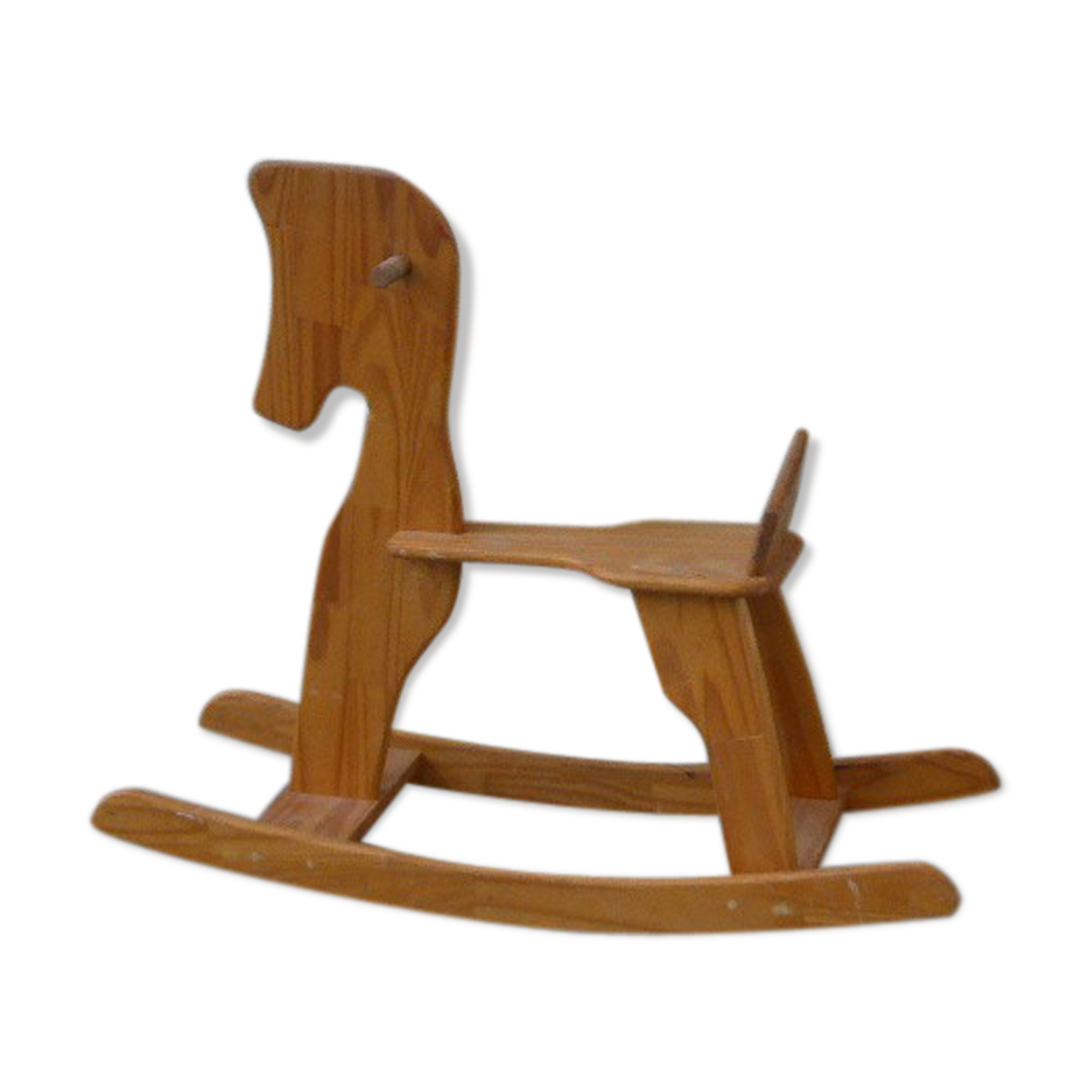 Horse rocking in pine