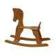 Horse rocking in pine