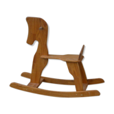 Horse rocking in pine