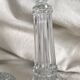 Column candle holders in moulded glass made in France.