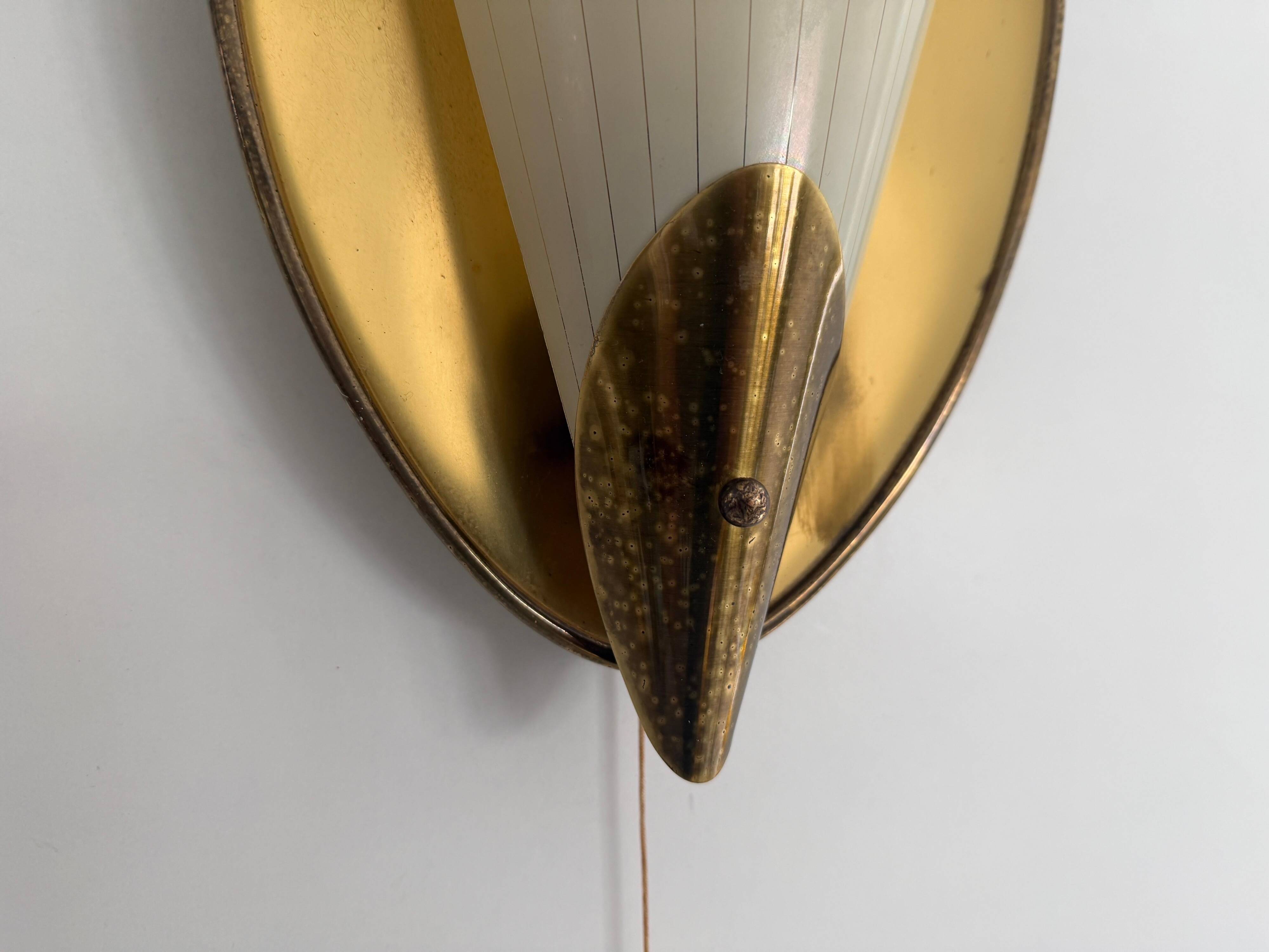 Pair of brass and glass wall lights from the mid-century, 1950s, Germany.