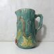 Antique turquoise Art Deco majolica pitcher vase with a snake motif