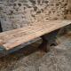 Old French industrial table with a cast iron base and a pine top.