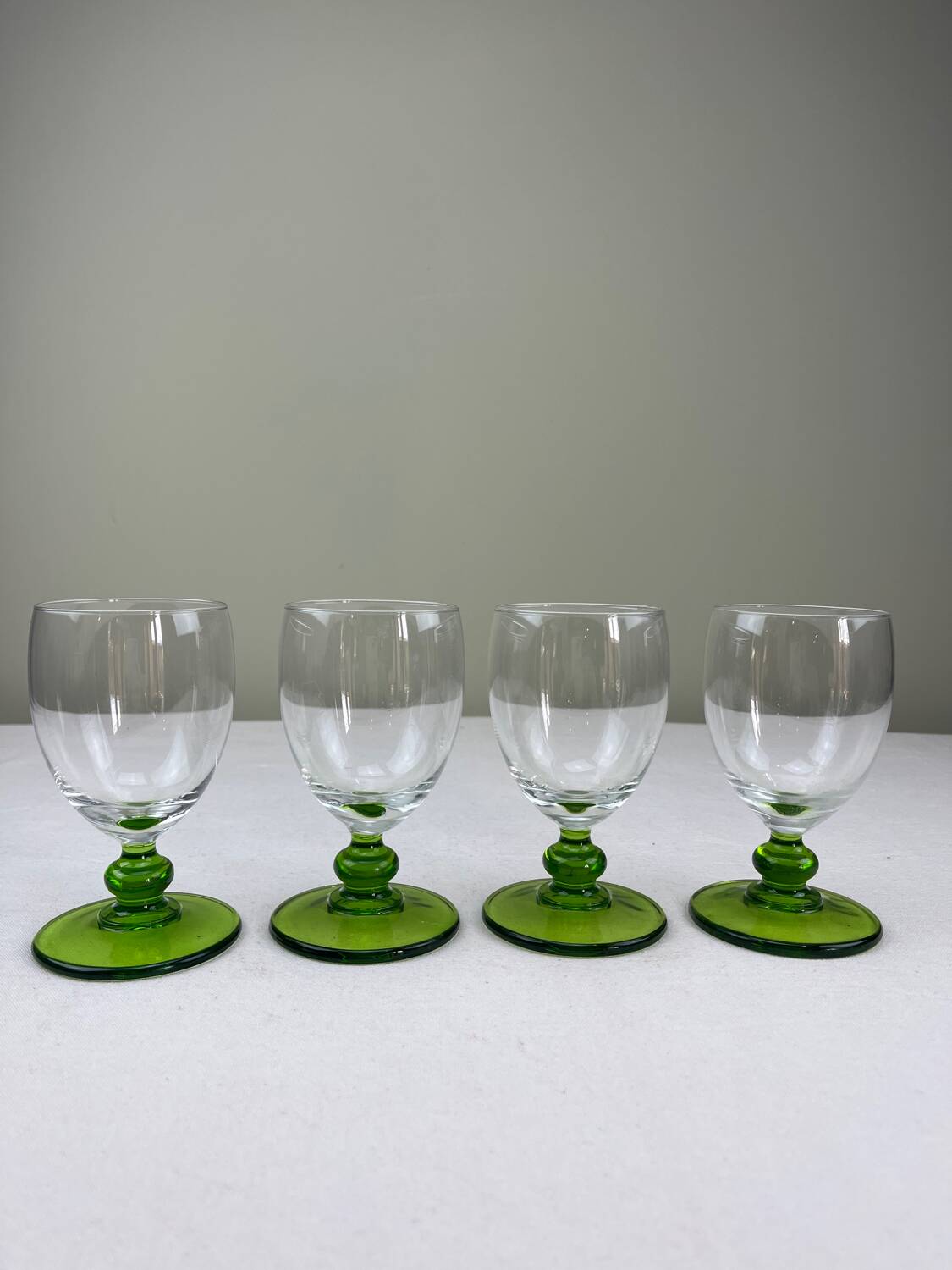 Green ball-shaped stemmed glasses