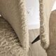 Pair of vintage barrel chairs in boucle fabric with brass splayed legs.