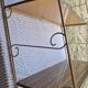 Wall shelf in metal with slanted shelves
