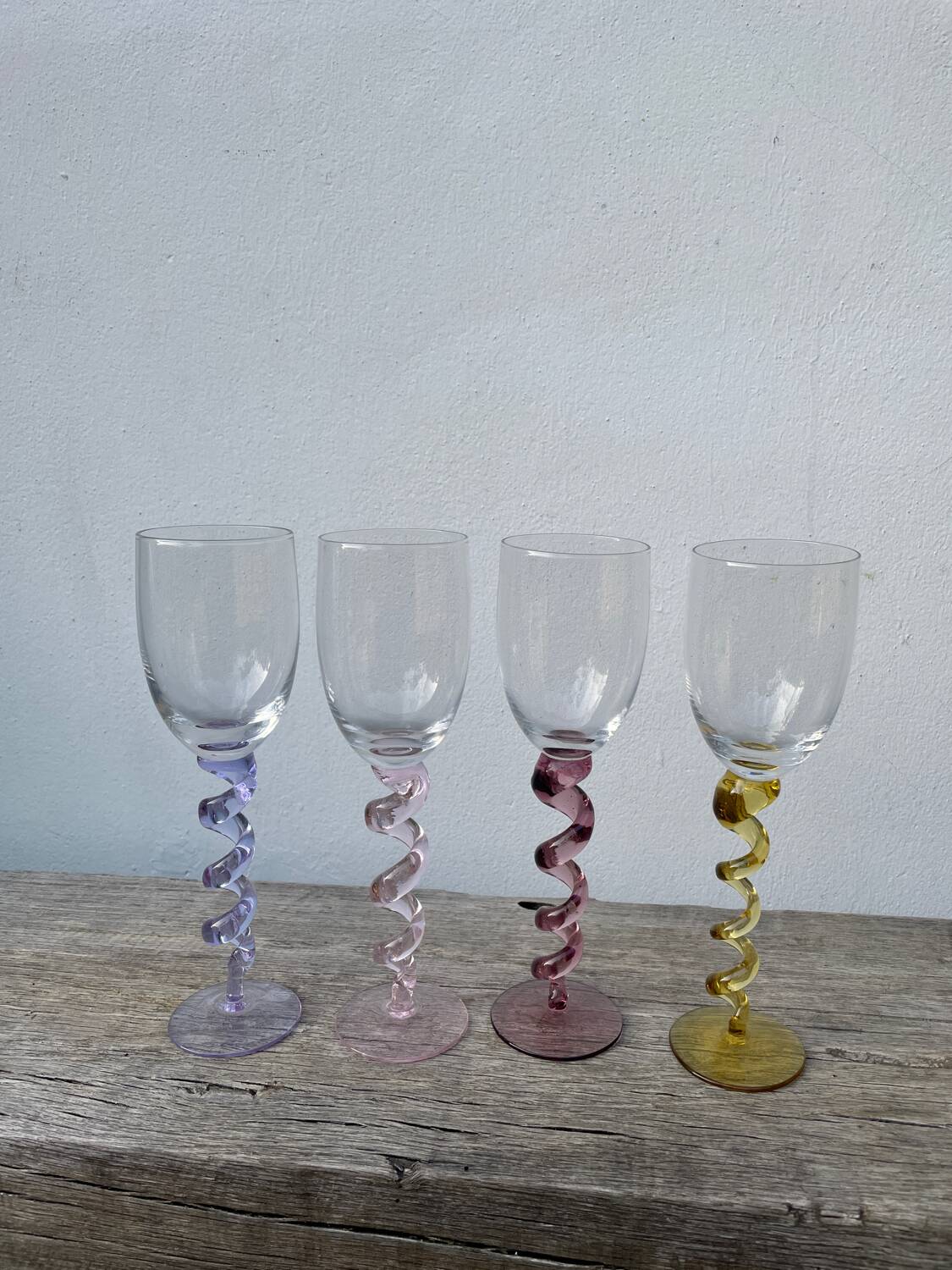 4 large, multicoloured, twisted champagne flutes