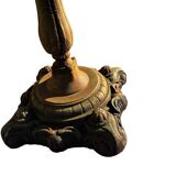 Antique cast iron garden table with decorative openwork top.