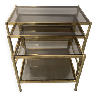 Suite de trois tables gigognes de style en laiton et verre fumé XX siècle